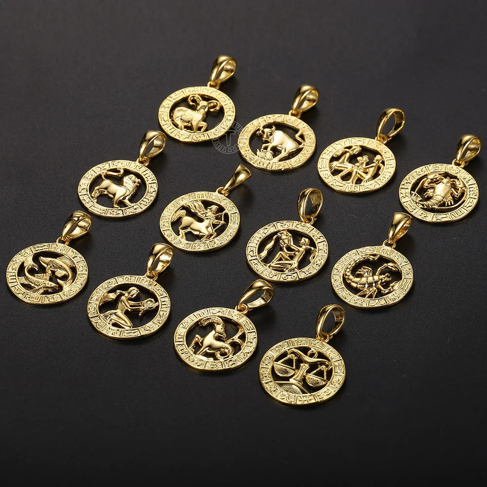 Gold zodiac pendants on a black background