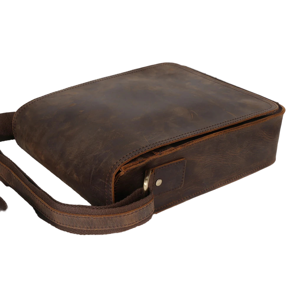 Brown leather crossbody bag with visible 'DUJIANG' branding on a white background