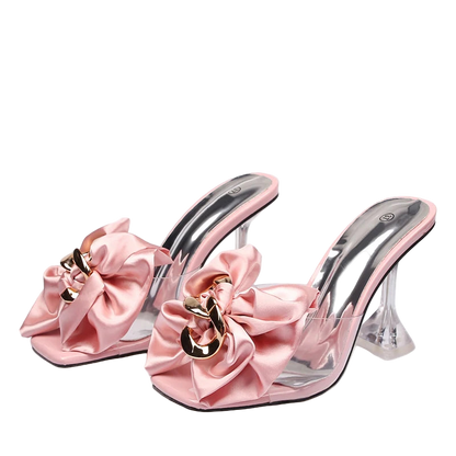 Pink high-heeled shoes with large bows