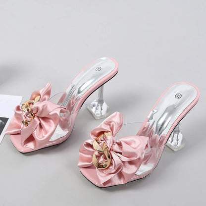 Pink satin shoes with gold accents